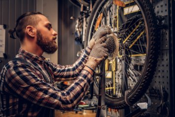 person fixing a bike in Dublin